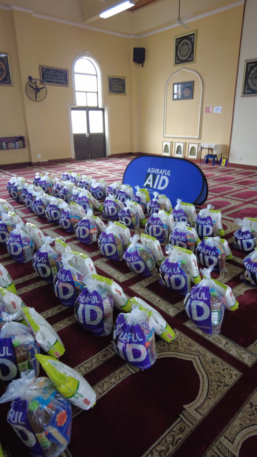 Rows of Ashraful Aid food hampers prepared before distribution